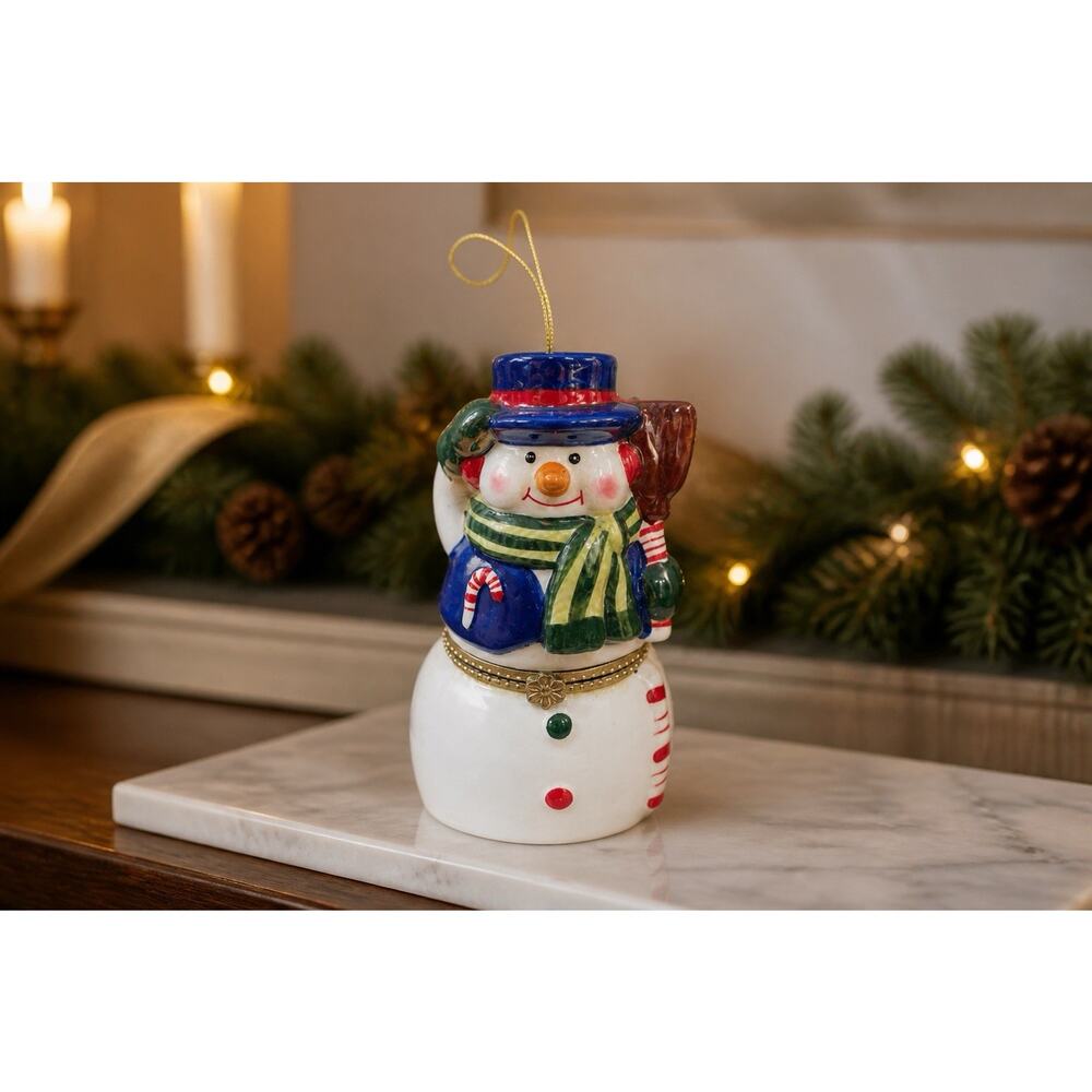 Mr. Christmas Porcelain Snowman is a Hinged Music Box Ornament